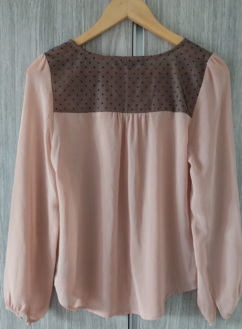Forever 21 Pink Polka Dot Chiffon Blouse (Category: Blouses) located in Makati City. Submitted by everythingp100 (Listing ID 1468776595, Image 2). Description: - Brand: Forever 21 - Size: Small - Color: Dusty Pink - Material: Lightweight sheer chiffon - Details: Long sleeves with gathered cuffs, keyhole neckline with loop button closure, curved hemline - Accent: Semi-sheer dark upper back panel with a cute polka dot pattern - Condition: Excellent