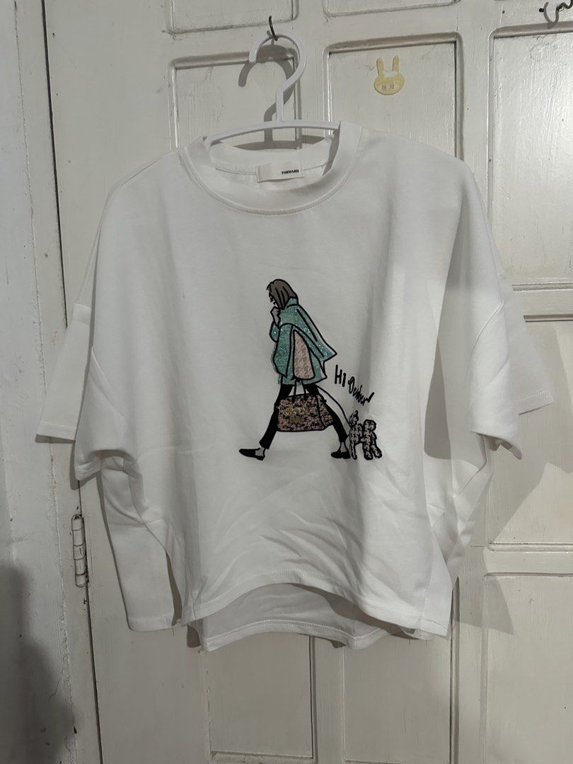 FORWARD White Graphic T-Shirt Oversized (Category: Others Tops) located in Naga. Submitted by leelovella64554 (Listing ID 1468778856, Image 1). Description: - Brand: FORWARD - Color: Clean crisp white - Fit: Relaxed oversized fit with short sleeves - Material: Soft and comfortable cotton - Design: Stylish ' October' graphic print with woman walking a dog - Condition: Brand new / Excellent - Perfect for effortless everyday casual wear.