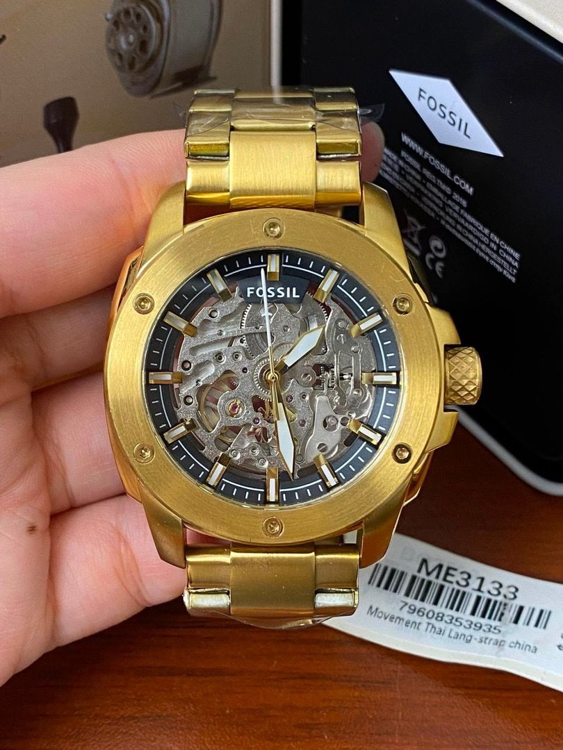 Fossil Skeleton Automatic Watch ME3133 ME3080 (Category: Men's Watches) located in Manila. Submitted by andeonne (Listing ID 1468751884, Image 2). Description: - Brand: Fossil mechanical skeleton watch - Condition: Brand new with original store tag ($269 retail) and box included - Dial: Clear skeleton dial displaying the inner working gears - Strap: Stainless steel bracelet wrapped in protective plastic - Details: Features a stylish textured crow