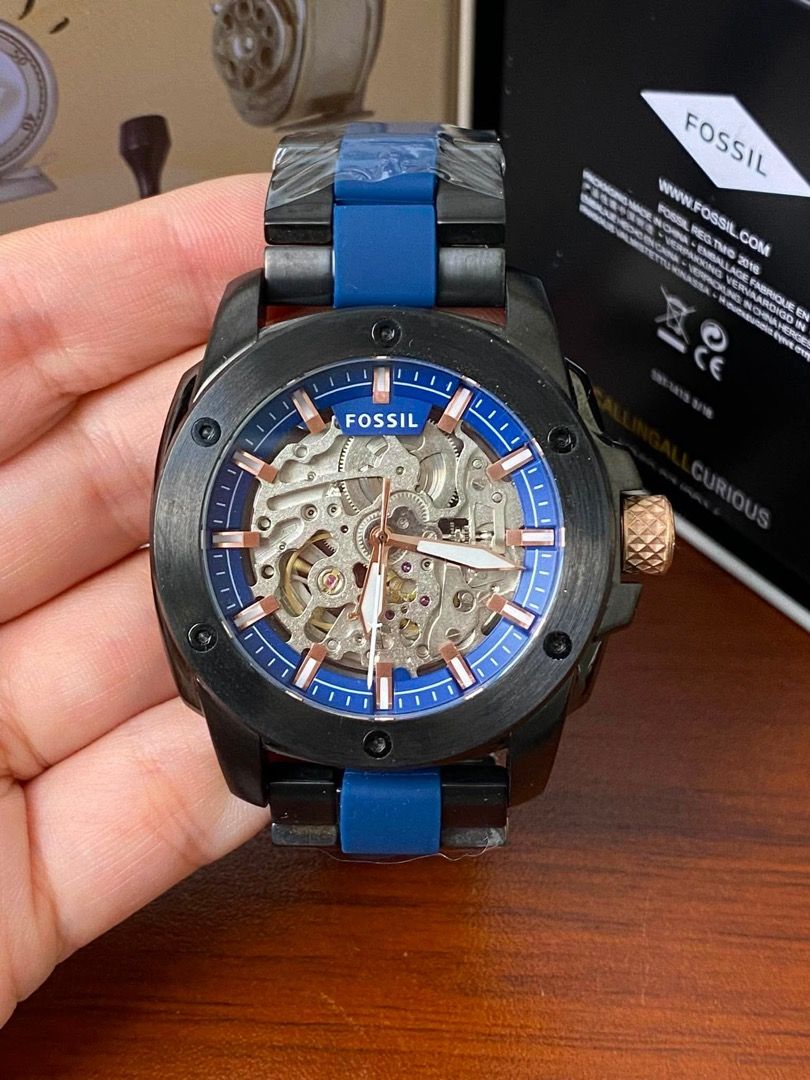 Fossil Skeleton Automatic Watch ME3133 ME3080 (Category: Men's Watches) located in Manila. Submitted by andeonne (Listing ID 1468751884, Image 3). Description: - Brand: Fossil mechanical skeleton watch - Condition: Brand new with original store tag ($269 retail) and box included - Dial: Clear skeleton dial displaying the inner working gears - Strap: Stainless steel bracelet wrapped in protective plastic - Details: Features a stylish textured crow