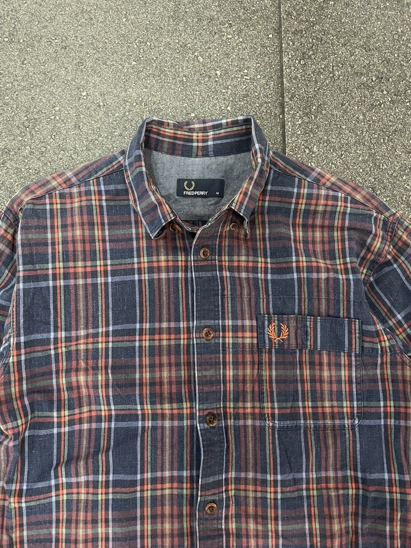 Fred Perry Checked Cotton Long Sleeves (Category: Formal Shirts) located in Pasay City. Submitted by daisys_goodies (Listing ID 1468756203, Image 1). Description: Fred Perry Checked Cotton Long-Sleeved Button-Up Shirt featuring a multi-color plaid/tartan pattern, button-down collar, and an embroidered Laurel Wreath logo on the chest pocket. Medium on tag Dimension: 20x27 Location: Pasay City Can ship through J&T or lalamove .