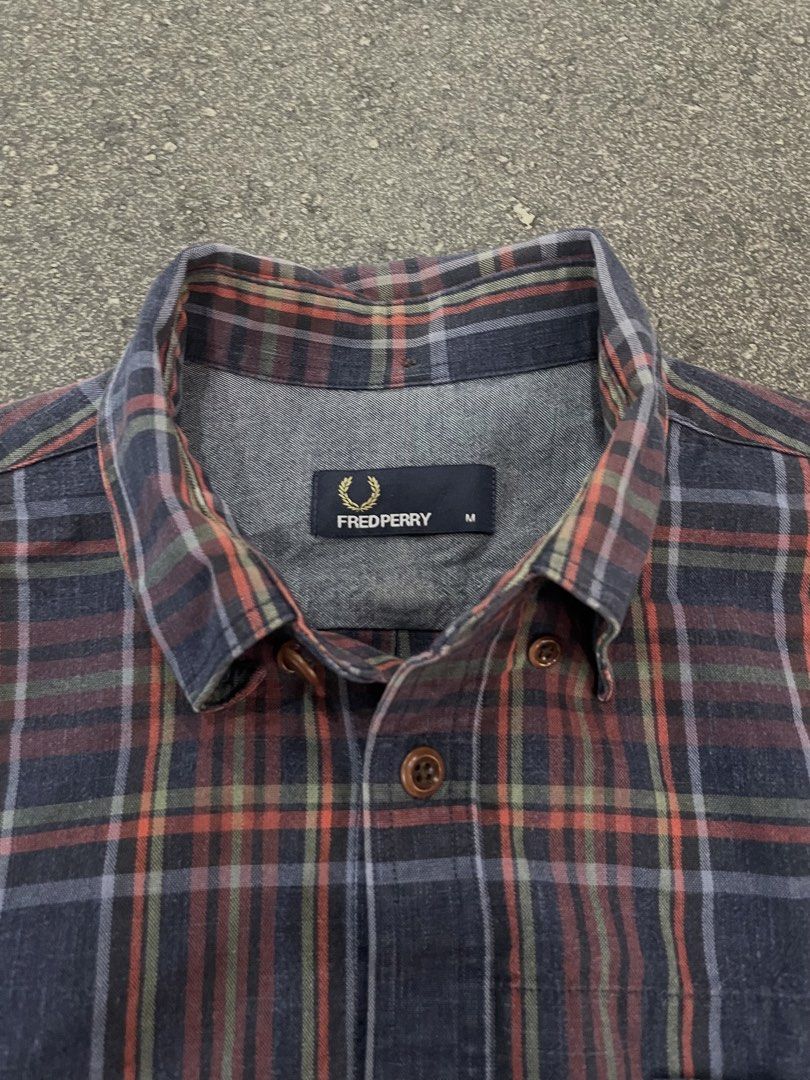 Fred Perry Checked Cotton Long Sleeves (Category: Formal Shirts) located in Pasay City. Submitted by daisys_goodies (Listing ID 1468756203, Image 3). Description: Fred Perry Checked Cotton Long-Sleeved Button-Up Shirt featuring a multi-color plaid/tartan pattern, button-down collar, and an embroidered Laurel Wreath logo on the chest pocket. Medium on tag Dimension: 20x27 Location: Pasay City Can ship through J&T or lalamove .
