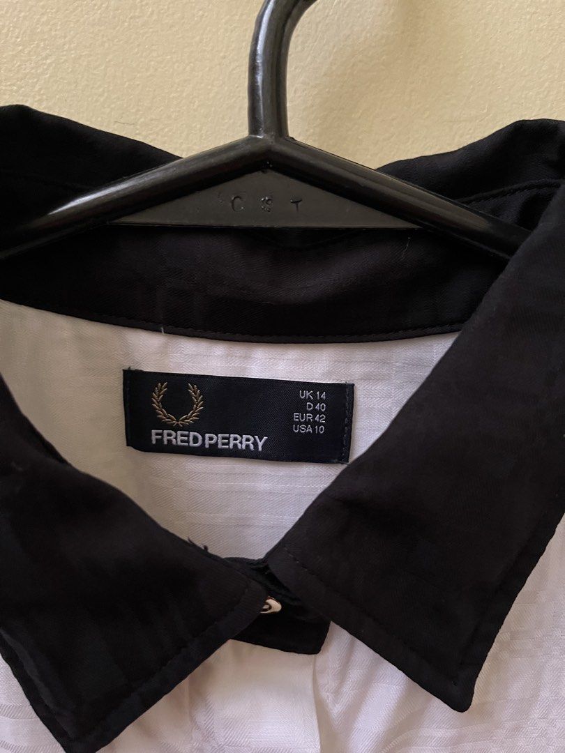 Fred Perry Long Sleeves - Women’s (Category: Longsleeves) located in Quezon City. Submitted by tintin_reyes (Listing ID 1468919553, Image 2). Description: Fred Perry Long Sleeves Women’s UK 14 White with subtle pattern Black collar With extra gold and plain buttons Used once - almost new condition RFS: seldom use / decluttering .