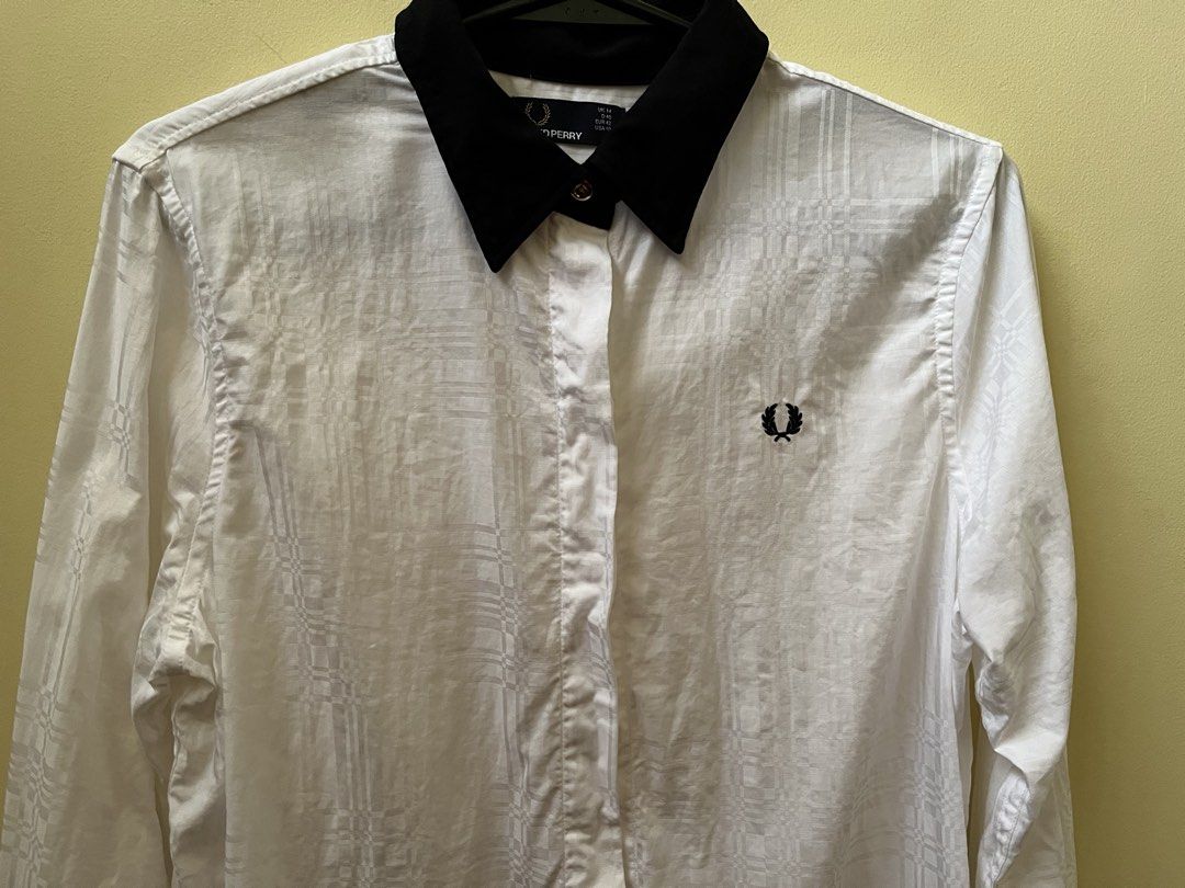 Fred Perry Long Sleeves - Women’s (Category: Longsleeves) located in Quezon City. Submitted by tintin_reyes (Listing ID 1468919553, Image 3). Description: Fred Perry Long Sleeves Women’s UK 14 White with subtle pattern Black collar With extra gold and plain buttons Used once - almost new condition RFS: seldom use / decluttering .