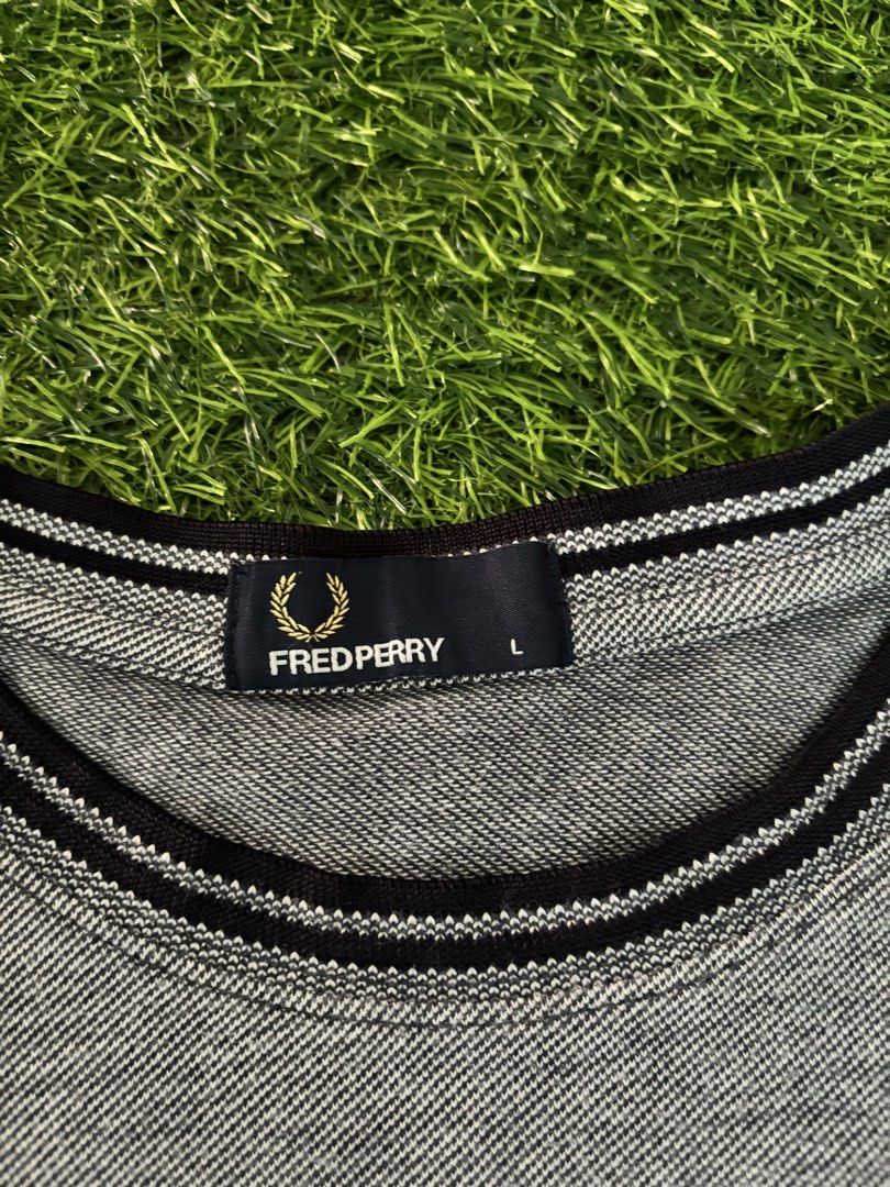 Fred Perry Men's Grey T-Shirt Size L (Category: Tshirts & Polo Shirts ) located in Makati City. Submitted by rare_thrift_stuff (Listing ID 1468730441, Image 2). Description: - Brand: Fred Perry - Color: Grey with black and white striped collar and sleeve cuffs - Size: L (tag attached) -Dimension 21/27.5 - Material: 100% breathable cotton - Details: Signature embroidered laurel wreath logo on the chest, includes inside wash and care labels - Condi