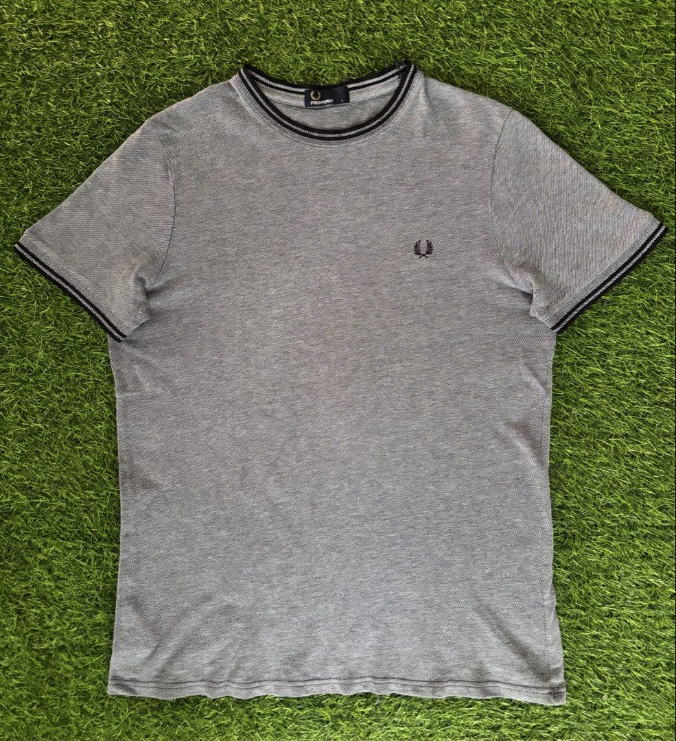 Fred Perry Men's Grey T-Shirt Size L (Category: Tshirts & Polo Shirts ) located in Makati City. Submitted by rare_thrift_stuff (Listing ID 1468730441, Image 1). Description: - Brand: Fred Perry - Color: Grey with black and white striped collar and sleeve cuffs - Size: L (tag attached) -Dimension 21/27.5 - Material: 100% breathable cotton - Details: Signature embroidered laurel wreath logo on the chest, includes inside wash and care labels - Condi
