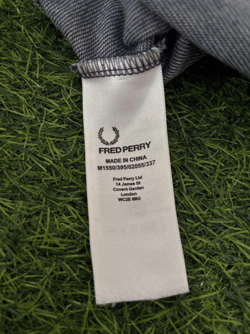 Fred Perry Men's Grey T-Shirt Size L (Category: Tshirts & Polo Shirts ) located in Makati City. Submitted by rare_thrift_stuff (Listing ID 1468730441, Image 3). Description: - Brand: Fred Perry - Color: Grey with black and white striped collar and sleeve cuffs - Size: L (tag attached) -Dimension 21/27.5 - Material: 100% breathable cotton - Details: Signature embroidered laurel wreath logo on the chest, includes inside wash and care labels - Condi