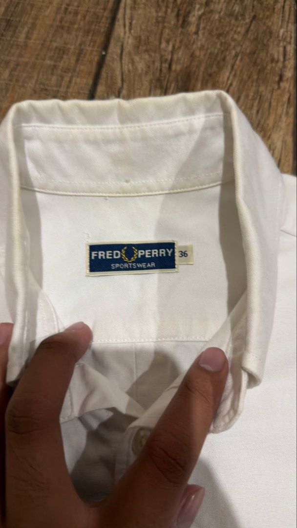FRED PERRY WHITE LOGO POLO (Category: Tshirts & Polo Shirts ) located in Manila. Submitted by urban.vintage (Listing ID 1468870944, Image 3). Description: ISSUE: NONE (NEED WASH) MOP :GCASH (NO COD) SHIP VIA: LALAMOVE & J&T LOCATION: PASIG CITY LENGTH: 27 WIDTH : 20 .
