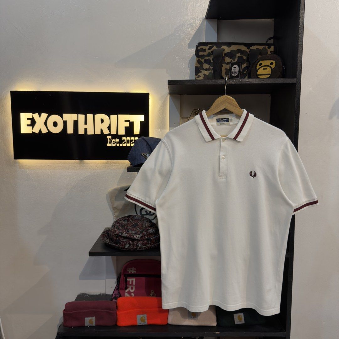 Fred Perry White Polo Shirt (Category: Tshirts & Polo Shirts ) located in Manila. Submitted by jerichomal82553 (Listing ID 1468906309, Image 1). Description: Fred Perry White Polo Shirt 21 by 28.5 Good Condition Complete Tags.