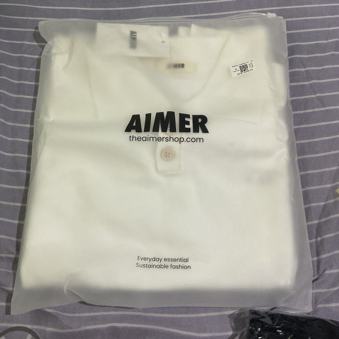 Freen Sarocha - AIMER Essential Knit Oversized Polo White (Category: Coats, Jackets and Outerwear) located in Cebu City. Submitted by jigyu13 (Listing ID 1468713018, Image 1). Description: - Brand: AIMER Essential - Item: Knit Oversized Polo - Color: White - Condition: Like new, still sealed in original branded frosted zip pouch with tags attached - Material: Heavy, sustainable fashion knit - Features: Classic button placket collar neck, clean mi