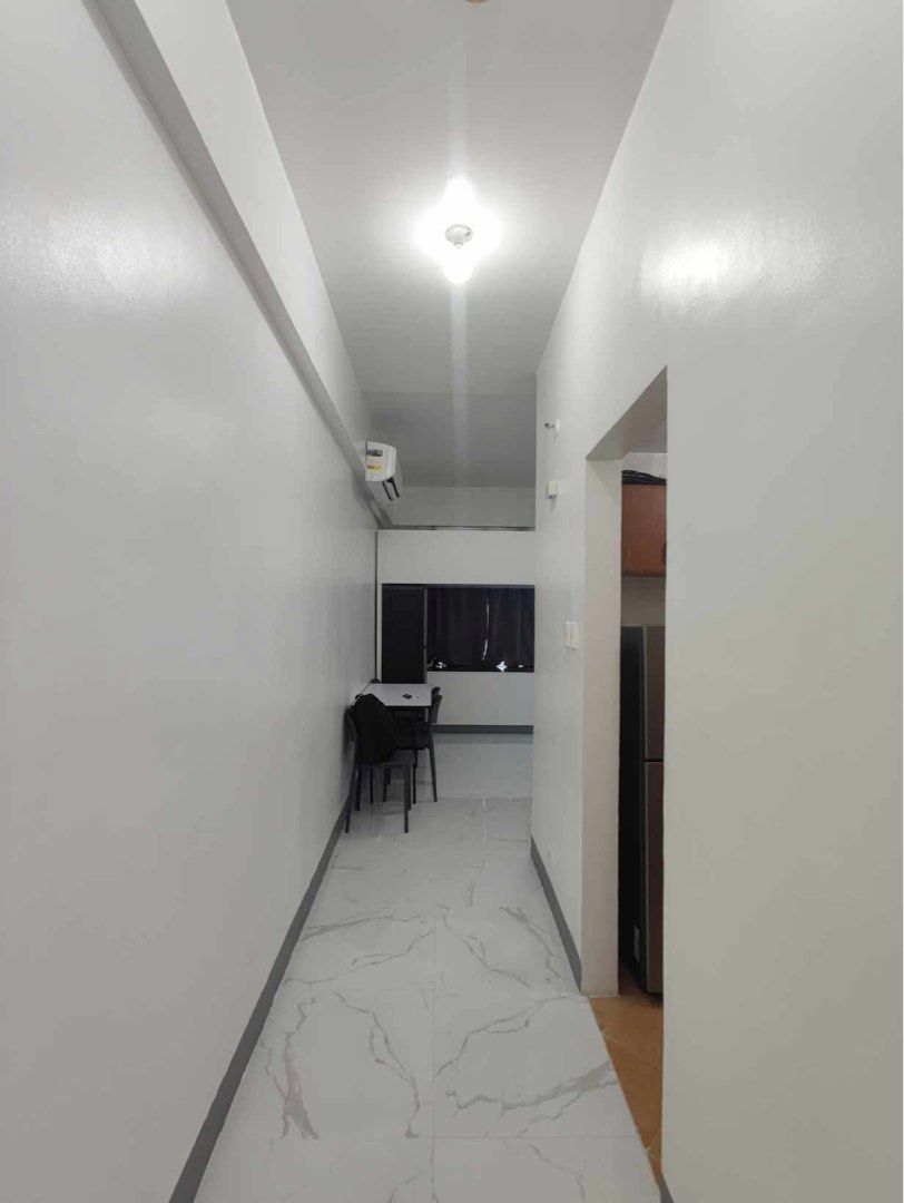 Fully Furnished Studio Unit for Rent (Category: Apartments & Condos) located in Makati City. Submitted by theacd (Listing ID 1468793558, Image 1). Description: - Studio unit ready for immediate occupancy - Sleeping area with bunk bed setup (upper and lower) - Study table with 4 chairs included - Brown storage cabinet for your belongings - Kitchen section with refrigerator, microwave, and upper wooden cabinets - Clean white walls and elegant marbl