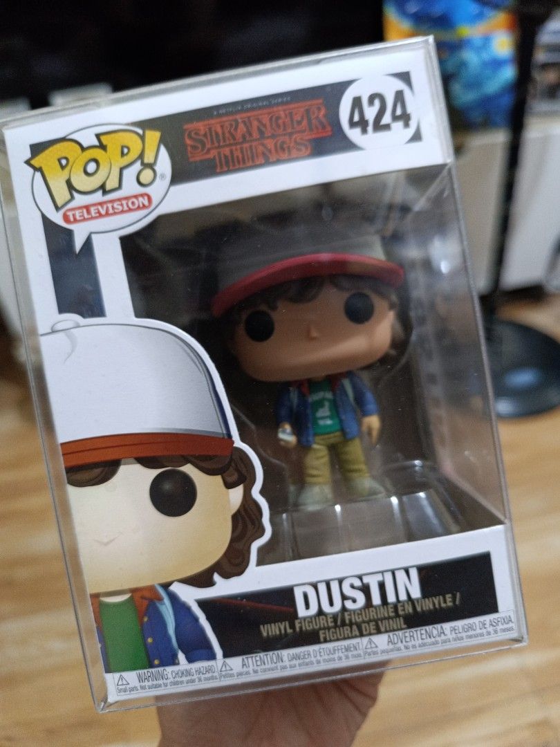 Funko Pop Stranger Things Dustin #424 (Category: Designer & Blind Box Toys) located in Makati City. Submitted by urbanhoarder (Listing ID 1468745984, Image 1). Description: Character: Dustin (Stranger Things) - Item: Funko Pop! Television #424 - Outfit: Classic look with trucker hat, blue jacket, and green shirt - Protection: Includes a clear plastic protector case - Authenticity: Official Netflix merchandise - Condition: Great addition to any Ha