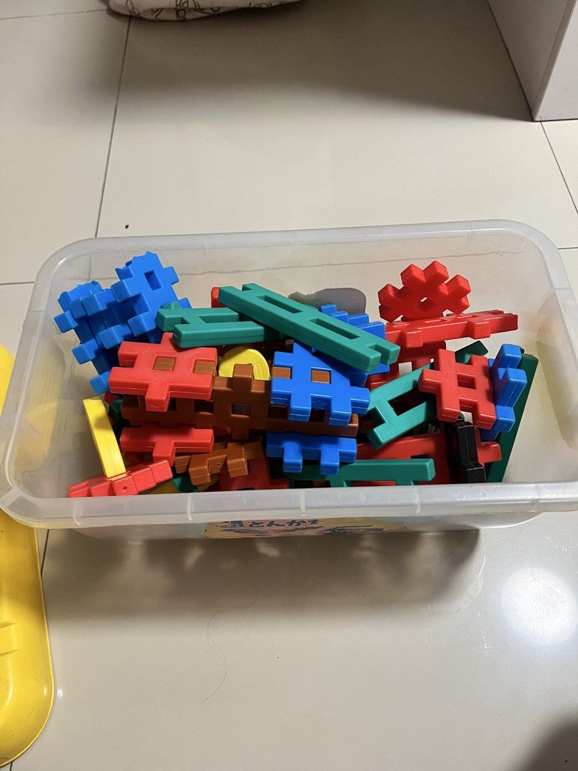 Gakken Tonkachi Blocks Set with Storage Box (Category: Lego & Building Sets) located in Quezon City. Submitted by prelovedbykhy (Listing ID 1468904593, Image 1). Description: STILL GOOD CONDITION - Authentic Japanese Gakken construction blocks set - Comes in a plastic storage container with a yellow lid - Colorful interlocking pieces in blue, red, brown, green, and yellow - Includes wheels, beams, and various connector shapes for building vehicle