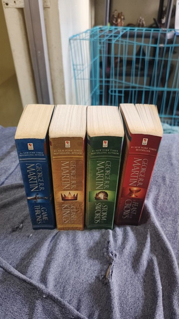 Game Of Thrones 4-Book Set (Category: Storybooks) located in Manila. Submitted by almanzakie00206 (Listing ID 1468776358, Image 2). Description: - Title: Game of Thrones 4-Book Paperback Set - Books included: A Game of Thrones, A Clash of Kings, A Storm of Swords, A Feast for Crows - Condition: Covers show minor shelf wear; pages are clean, complete, and uncreased - Value: Budget-friendly way to enjoy the complete epic fantasy masterpiece - Shipp