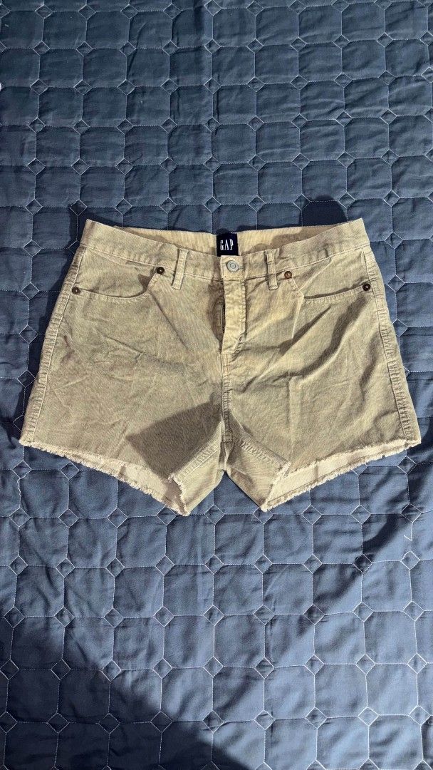 GAP Corduroy Cutoff Shorts Khaki Size Medium (Category: Shorts) located in Manila. Submitted by itz_zy (Listing ID 1468852074, Image 1). Description: - Brand: GAP - Style: Corduroy cutoff shorts with raw frayed hem - Color: Khaki green - Fit: Mid-rise with zip fly and button closure - Details: Classic five-pocket styling, soft ribbed texture - Condition: Great casual staple piece - Mode of Payment: GCash, BPI, or Maya - Shipping: Via J&T Express 