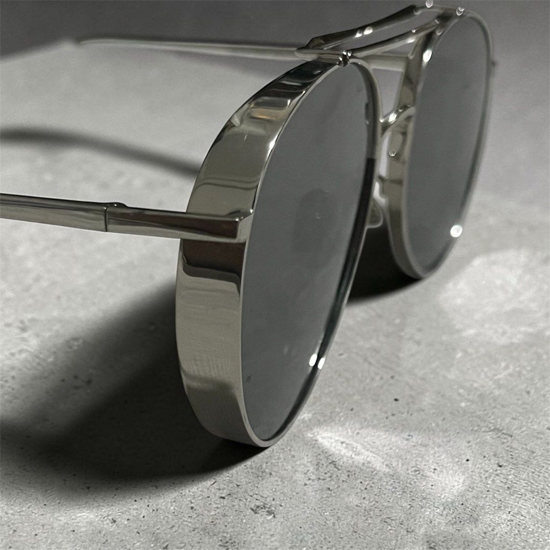 Gentle Monster Big Bully Titanium Frame (Category: Sunglasses & Eyewear) located in Manila. Submitted by chococoffeeboy (Listing ID 1468878518, Image 3). Description: Gentle Monster Big Bully Titanium - Style: Classic aviator -With double brow bar - Color: Silver-tone lightweight titanium frame with mirror grey lenses -Made in Korea -No scratches -Replacement Gentle Monster pouch & cleaning fabric Payment: Gcash/Maya.