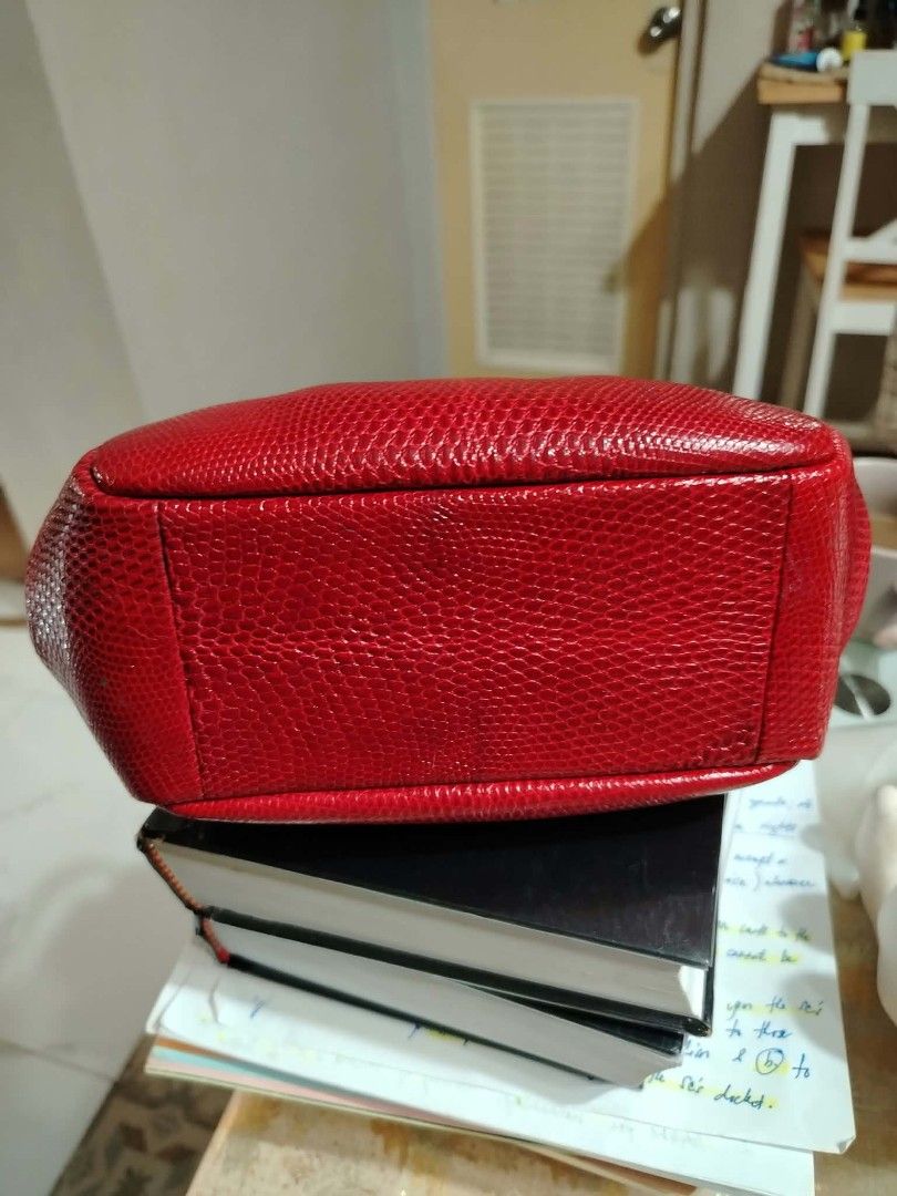 Genuine lizard kiss lock handbag (Category: Shoulder Bags) located in Paranaque City. Submitted by yensfashionfinds (Listing ID 1468739766, Image 2). Description: - Color & Texture: Bright red genuine lizard - Design: Structured body with trendy gathered front pleats - Closure: Secure silver-tone kiss lock frame - Straps: Dual handles in a contrasting dark tone - Base: Flat rectangular base for stability - Size: Compact yet spacious enough for da
