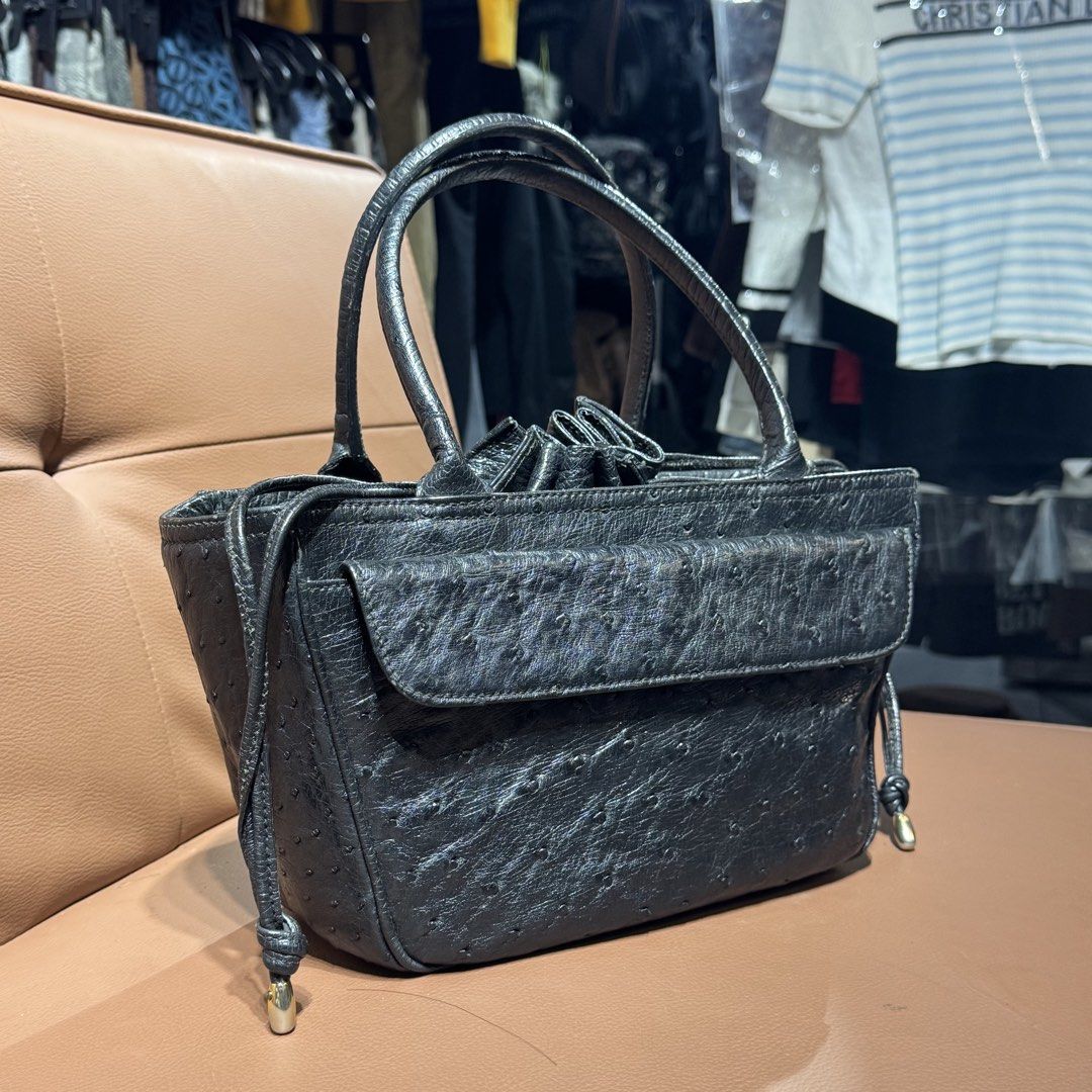 Genuine ostrich leather handbag (Category: Tote Bags) located in Rizal. Submitted by houseofbell (Listing ID 1468925205, Image 2). Description: - Material ostrich leather - Design: Structured tote bag with clean stitching throughout - Handles: Twin top handles for easy everyday carrying - Pockets & Closure: Front flap pocket with snap closure and open main compartment - Special Details: Drawstring sides with metallic tips and reinforced flat bott