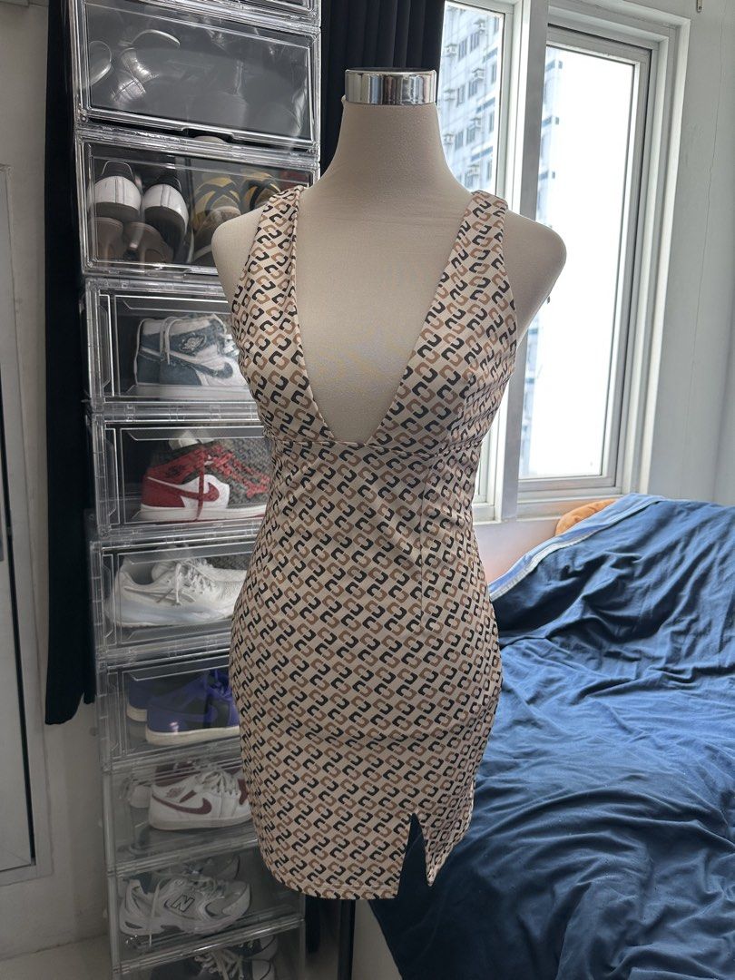 Geometric Print Deep V-Neck Bodycon Mini Dress (Category: Dresses) located in Quezon City. Submitted by valeriorac74670 (Listing ID 1468816513, Image 2). Description: - Geometric pattern in chic beige, black, and brown tones - Deep plunging V-neckline with supportive thick straps - Form-fitting bodycon silhouette ending at mid-thigh with a subtle front slit - Comfortable, stretchy fabric that moves with you - Ideal for parties, dates, and nights 
