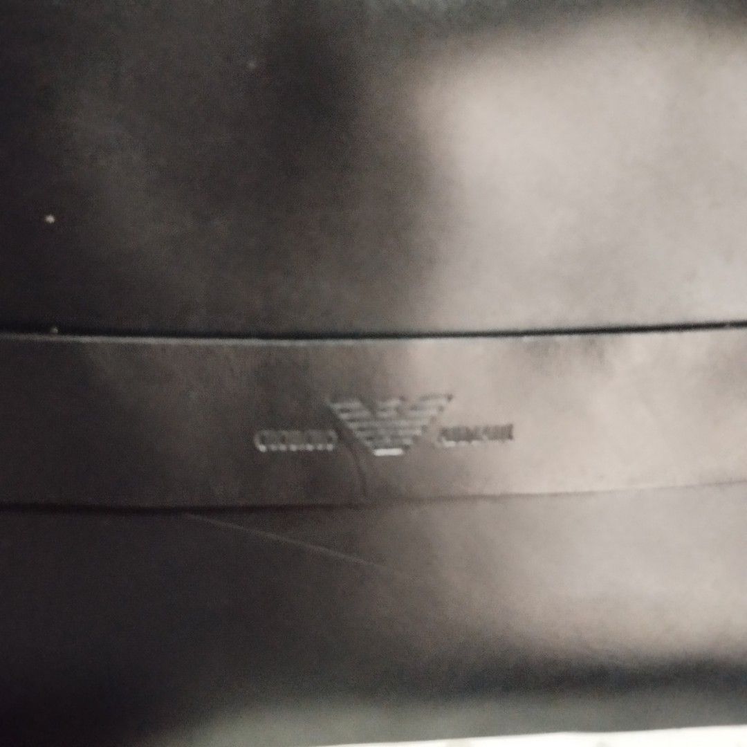 Giorgio Armani Black Leather Messenger Bag (Category: Sling Bags) located in Manila. Submitted by lene48 (Listing ID 1468747441, Image 2). Description: - AGiorgio Armani black messenger bag - Sleek design with embossed branding and signature eagle logo strap - Durable fabric body built for daily wear - Adjustable shoulder strap for a comfortable fit - Spacious main compartment fits work documents and essentials - Interior zippered pocket for secu