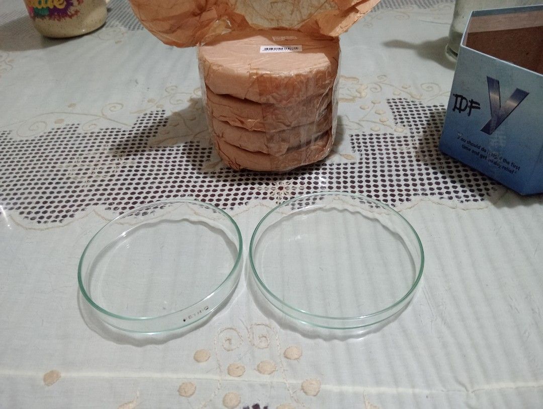 Glass Petri Dishes Laboratory Labware (Category: Dinnerware & Cutlery) located in Makati City. Submitted by YSL80022 (Listing ID 1468747584, Image 2). Description: - Unused glass petri dishes in pristine condition, 1 base and cover per set - Features 'PETRIQ' stamp on the side rim for authenticity - Clear and transparent round laboratory design - Securely wrapped in original brown paper packaging - Ideal for laboratory use, experiments, or scienc