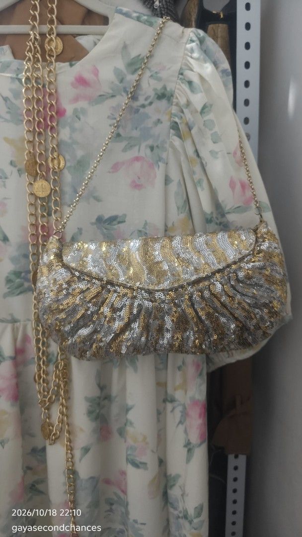 GOLD & SILVER SEQUIN-EMBELLISHED EVENING BAG (Category: Clutches) located in Kalibo. Submitted by secondchances.thriftsh8p (Listing ID 1468889975, Image 3). Description: - Stunning gold and silver sequin design with a chic animal-inspired pattern - Secure flap closure with elegant gathered texture near the base - Includes a detachable/thin gold-tone chain strap for versatile wear - Compact size, ideal for evening events, parties, and night outs -