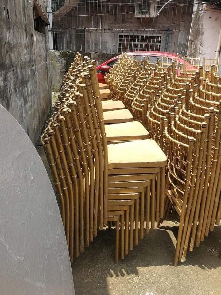 Tifanny chair for rent (Category: Chairs) located in Quezon City. Submitted by bjorn02 (Listing ID 1468853587, Image 2). Description: - Set of gold Chiavari chairs, perfect for weddings, parties, and catering businesses - Classic bamboo-style frame with a durable painted gold finish - Sturdy metal build equipped with comfortable flat cushioned seats - Neatly stackable for easy storage and transport - Shows minor scuffs and wear from regular use, 