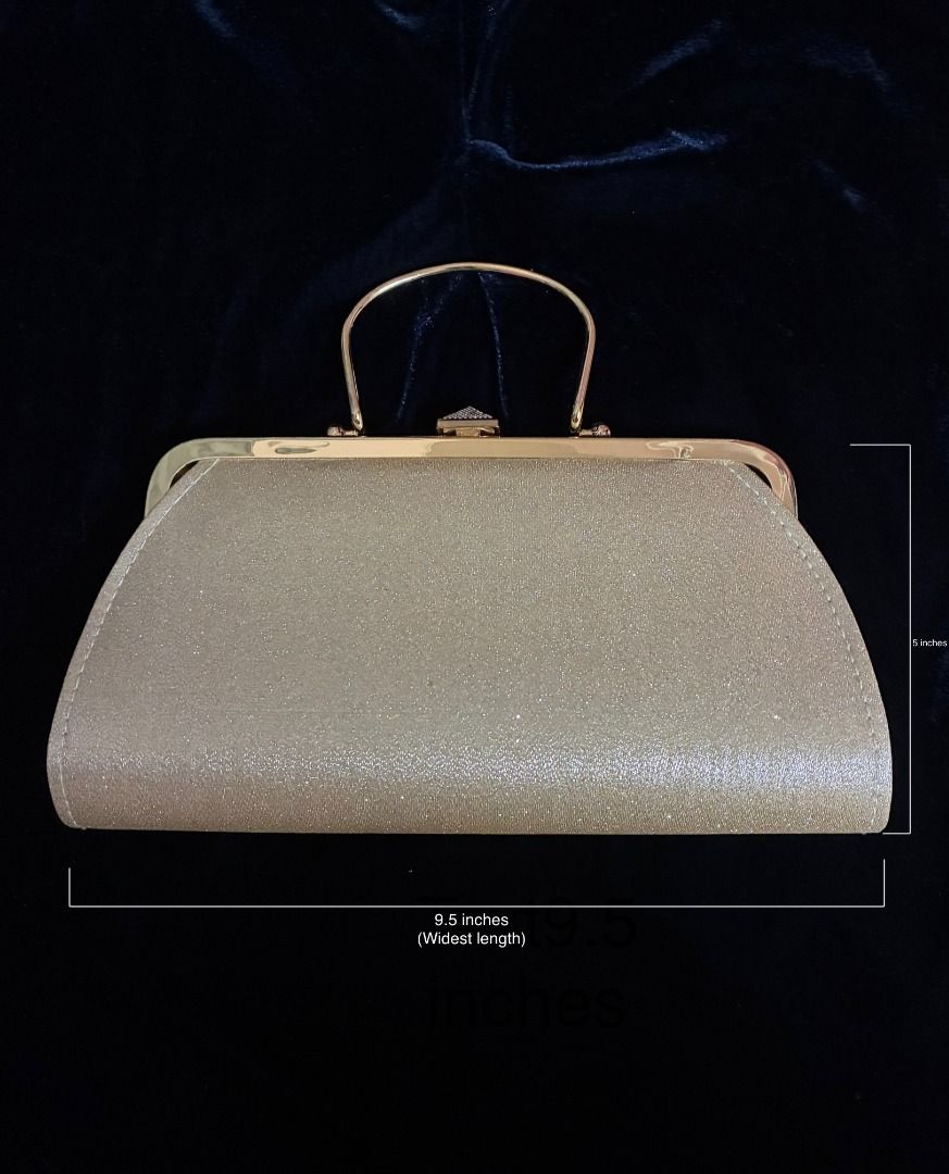 Gold Evening Bag | Clutch | Gold Tone Hardware (Category: Clutches) located in Quezon City. Submitted by maskedrecollections (Listing ID 1468913321, Image 2). Description: ✨ Gold glitter evening clutch with a structured frame and top handle. ✨ Rhinestone-encrusted pyramid clasp. ✨ Interior lined in dark fabric with a small slip pocket. ✨ Metal hardware in gold tone. ✨ Size: 9.5 inches at widest length at the bottom x 5 inches (see photo) ✨ Good f