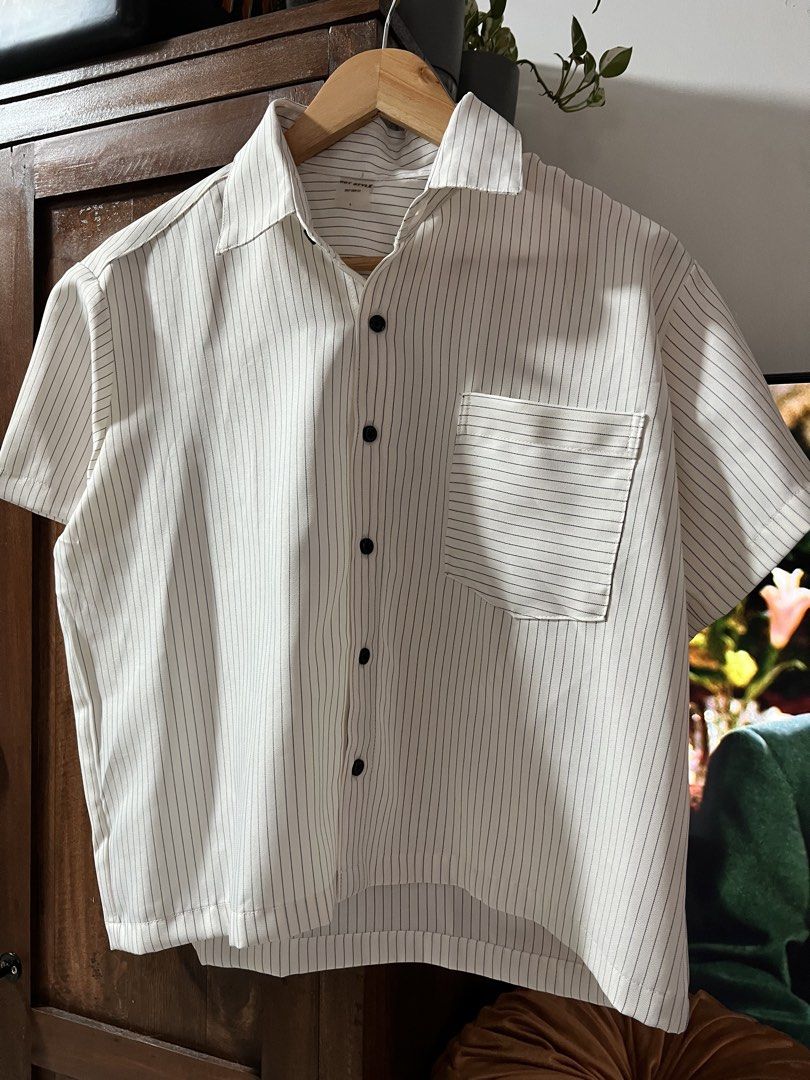 GOT STYLE Boxy Crop Fit Striped Shirt Medium (Category: Shirts) located in Quezon City. Submitted by sell4less123 (Listing ID 1468752647, Image 1). Description: Never worn/ no issues - Brand: Got Style - Size: Medium - Color/Pattern: White with thin black pinstripes - Style: Boxy crop fit, short sleeves, single chest pocket, black front buttons - Condition: Clean, minimalist look - Pairing: Easy to match with high-waisted denim or trousers Strict