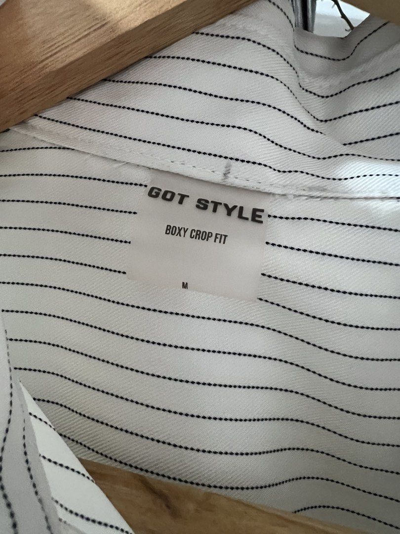 GOT STYLE Boxy Crop Fit Striped Shirt Medium (Category: Shirts) located in Quezon City. Submitted by sell4less123 (Listing ID 1468752647, Image 2). Description: Never worn/ no issues - Brand: Got Style - Size: Medium - Color/Pattern: White with thin black pinstripes - Style: Boxy crop fit, short sleeves, single chest pocket, black front buttons - Condition: Clean, minimalist look - Pairing: Easy to match with high-waisted denim or trousers Strict