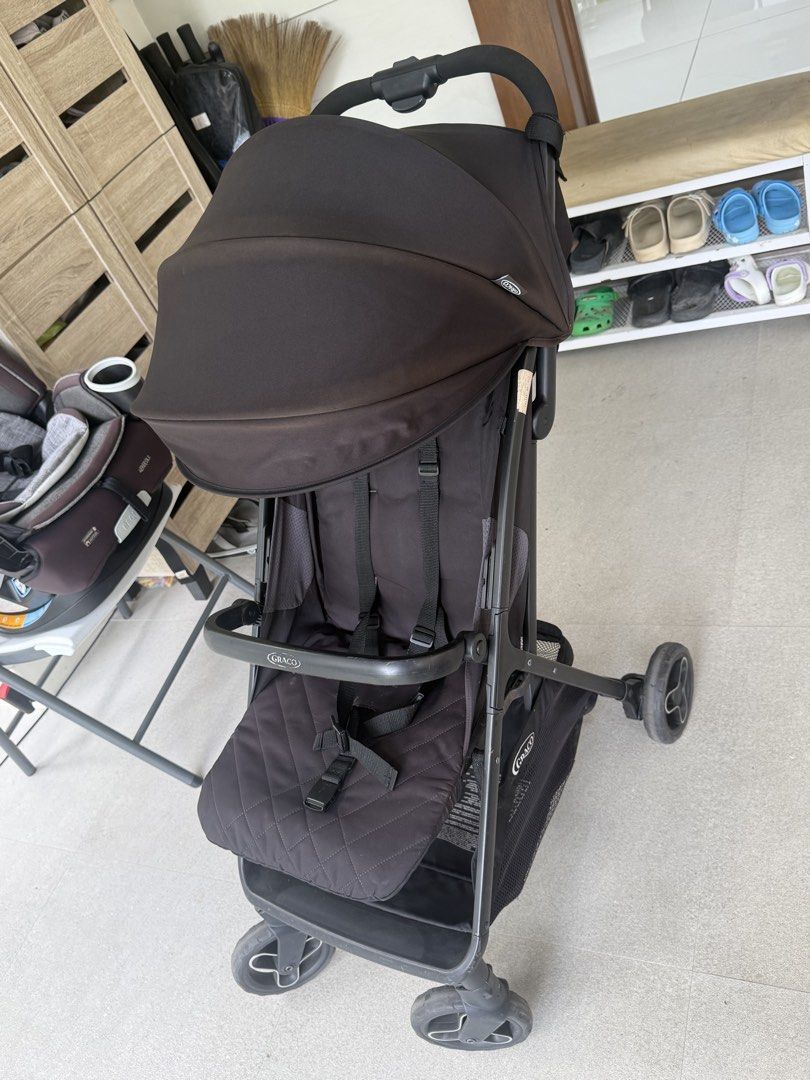 Graco Black Baby Stroller (Category: Strollers) located in Cavite. Submitted by heyitsmeberna (Listing ID 1468756830, Image 3). Description: - Color: Black - Brand: Graco - Large canopy hood for sun protection - Quilted padded seat insert for extra comfort - Built-in underseat storage basket for bags and toys - Lightweight frame that folds easily for travel and storage - Condition: Normal signs of use on the fabric.