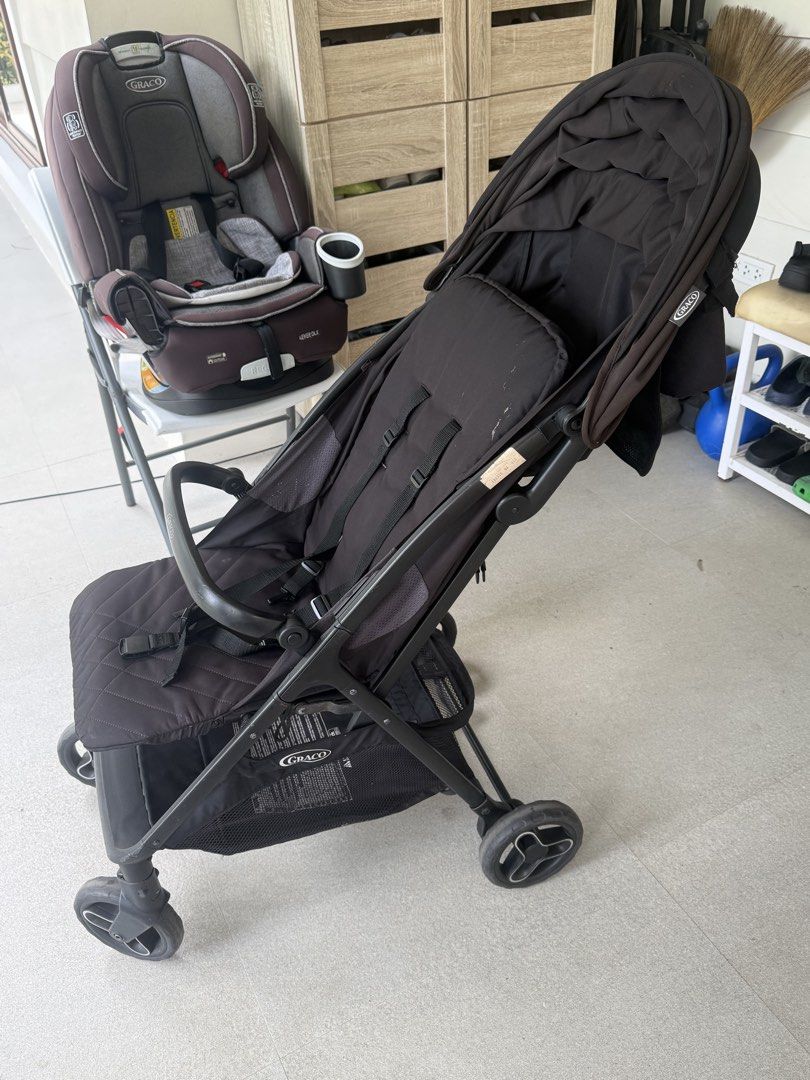 Graco Black Baby Stroller (Category: Strollers) located in Cavite. Submitted by heyitsmeberna (Listing ID 1468756830, Image 2). Description: - Color: Black - Brand: Graco - Large canopy hood for sun protection - Quilted padded seat insert for extra comfort - Built-in underseat storage basket for bags and toys - Lightweight frame that folds easily for travel and storage - Condition: Normal signs of use on the fabric.