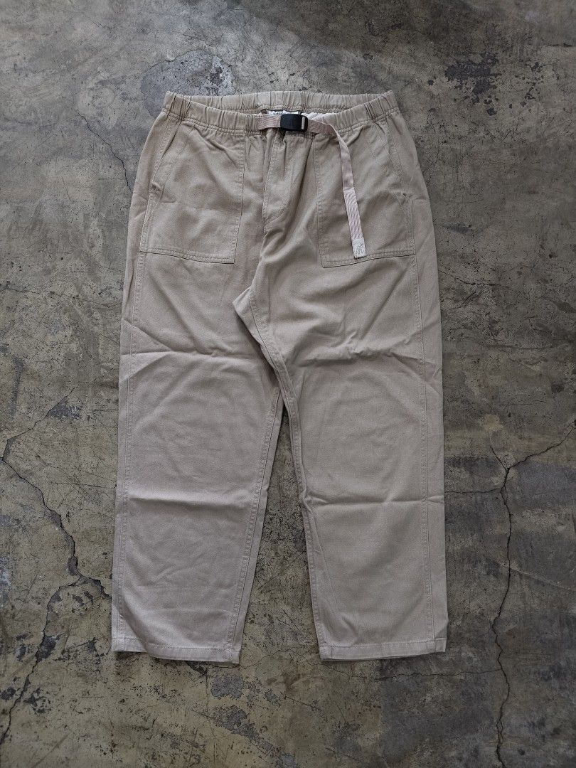 Gramicci Khaki Loose Taper Pants (Category: Trousers) located in Pasig City. Submitted by loveforlux_2025 (Listing ID 1468789682, Image 1). Description: - Brand: Gramicci - Style: Climbing Pants / Outdoor Trousers - Color: Khaki - Size: XL - Material: 98% Cotton, 2% Polyurethane (slight stretch) - Features: Signature integrated belt and buckle, elastic waistband, two front patch pockets, and rear welt pocket with branded label - Origin: Made in C