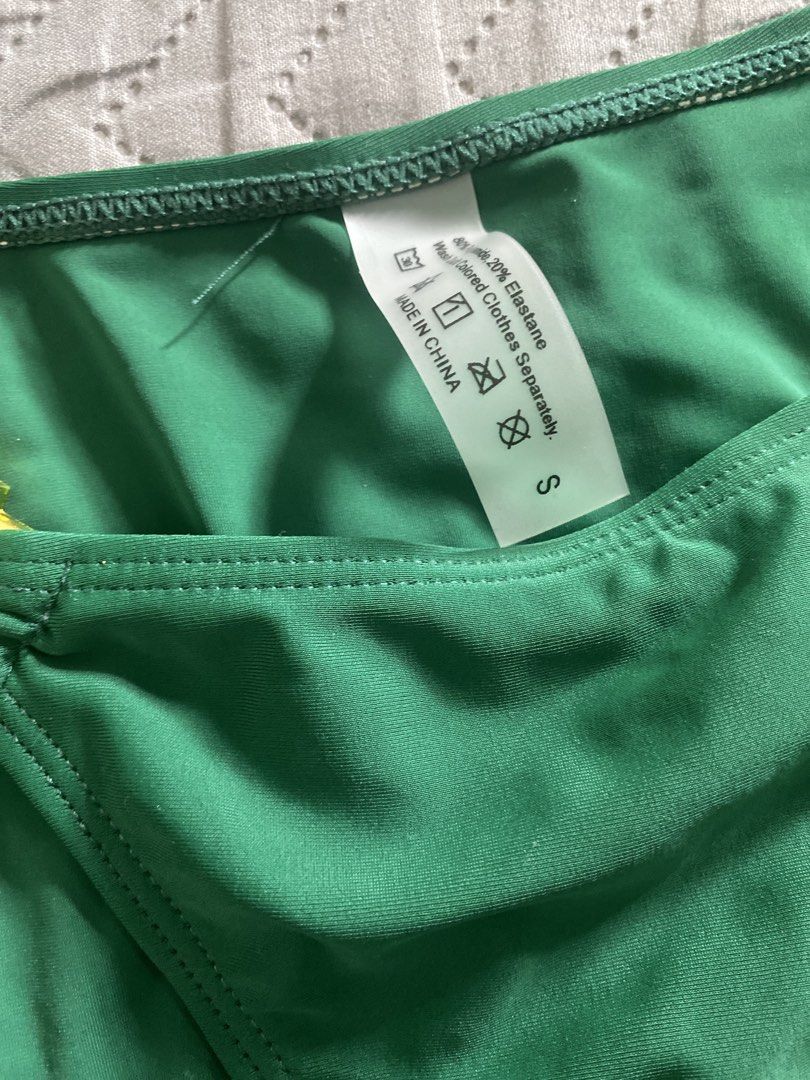 Green bikini set with rhinestone hardware size S (Category: Bikinis & Swimsuits) located in Manila. Submitted by newkkmora98454 (Listing ID 1468750696, Image 2). Description: - Condition: Brand new, unworn. Bought it for swimming pero di natuloy - Size: Small - Color: Emerald green - Style: Triangle halter top with matching side-tie bottoms - Details: Gold-tone hardware with large green crystal accent stones - Material: 80% polyamide, 20% elastan