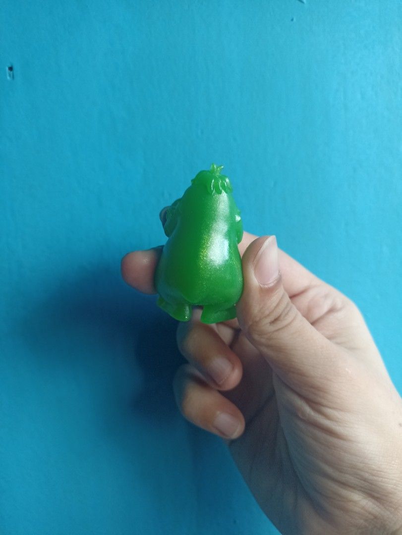 Green Ditty Toy Figurine (Category: Designer & Blind Box Toys) located in Manila. Submitted by hobbymo_koleksyon.ph (Listing ID 1468759695, Image 2). Description: - Item: Translucent green Ditty figurine - Features: Big round eyes, stubby arms and legs, textured hair detail - Finish: Smooth and glossy with a sparkly glitter look underneath - Condition: Clean, flawless, and free of scuffs or marks.