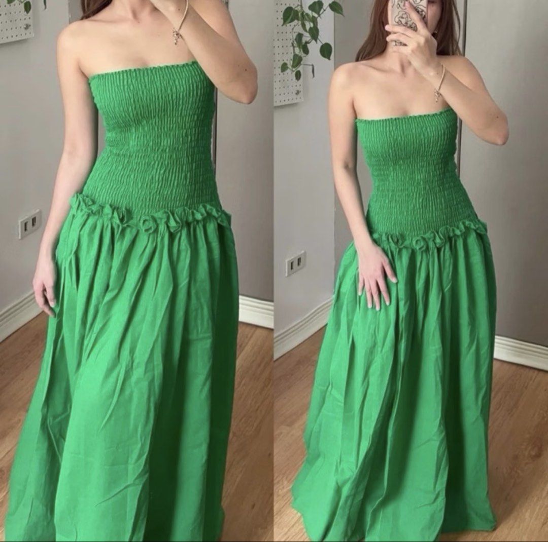 Green Strapless Smocked Maxi Dress (Category: Dresses) located in Quezon City. Submitted by ynnapenyaranda (Listing ID 1468785048, Image 1). Description: - Color: Bright green - Style: Strapless maxi dress with a flowy pleated skirt - Fit: True to size with a stretchy smocked bodice and easy slip-on design - Details: Dropped waistline with ruffled trim - Material: Lightweight, perfect for warm weather and beach trips - Condition: Worn once only.