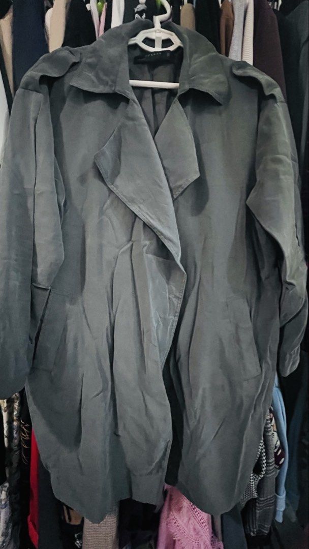 Green Trench Coat Jacket (Category: Coats, Jackets and Outerwear) located in Quezon City. Submitted by kishey (Listing ID 1468782675, Image 2). Description: - Color: Green - Style: Open front design (no buttons), shoulder epaulets, center inverted pleat at the back - Pockets: side pockets - Fabric: Lightweight drape, perfect for layering - Measurements: Bust 46 inches, Length 38 inches.