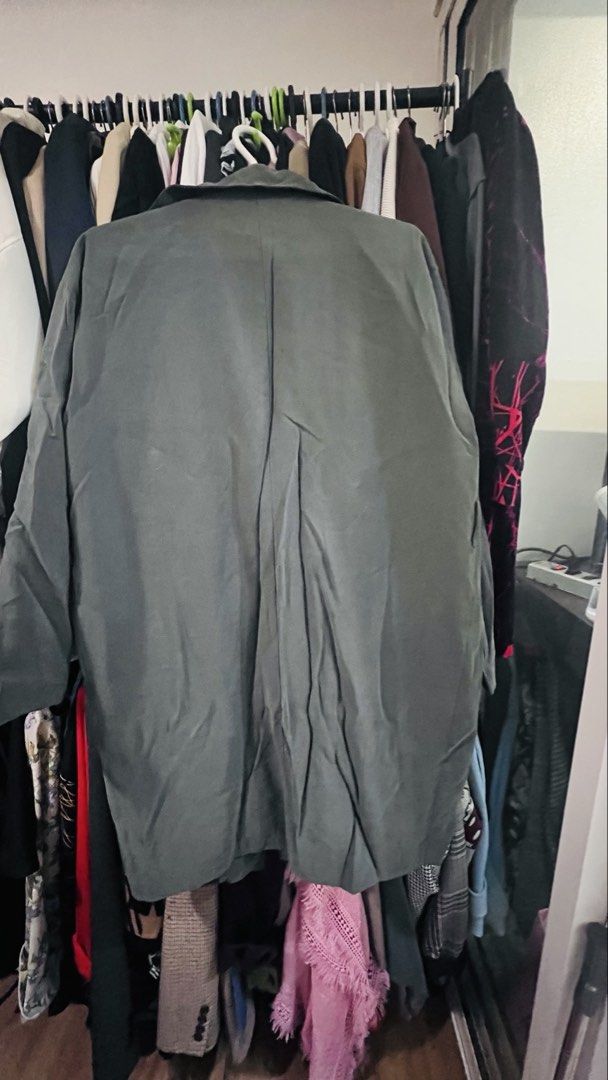 Green Trench Coat Jacket (Category: Coats, Jackets and Outerwear) located in Quezon City. Submitted by kishey (Listing ID 1468782675, Image 3). Description: - Color: Green - Style: Open front design (no buttons), shoulder epaulets, center inverted pleat at the back - Pockets: side pockets - Fabric: Lightweight drape, perfect for layering - Measurements: Bust 46 inches, Length 38 inches.