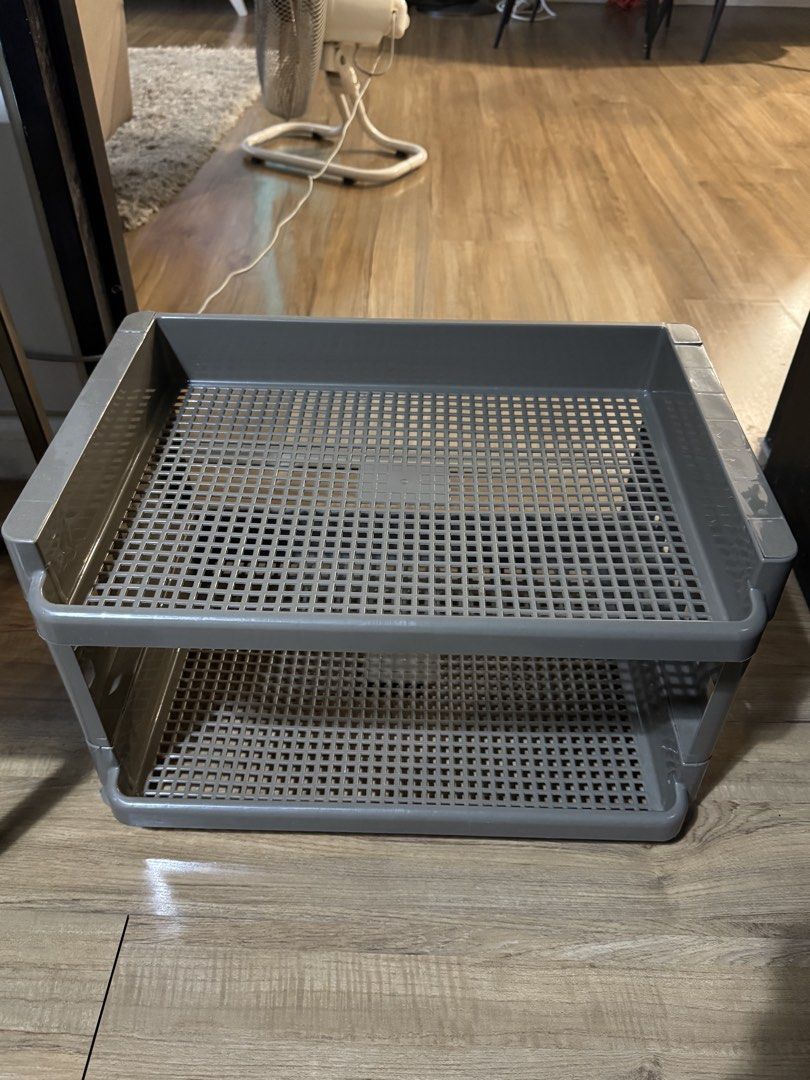 Grey 2-Tier Plastic Storage Rack Organizer Tray (Category: Storage Boxes & Baskets) located in Caloocan City. Submitted by newcrystal_3b43ba (Listing ID 1468799097, Image 2). Description: - Color: Grey - Material: Sturdy plastic - Design: 2-tier with grid pattern for great airflow - Versatile: Perfect for organizing desk supplies, bathroom essentials, or kitchen counters - Maintenance: Easy to wipe clean and keep things neat.