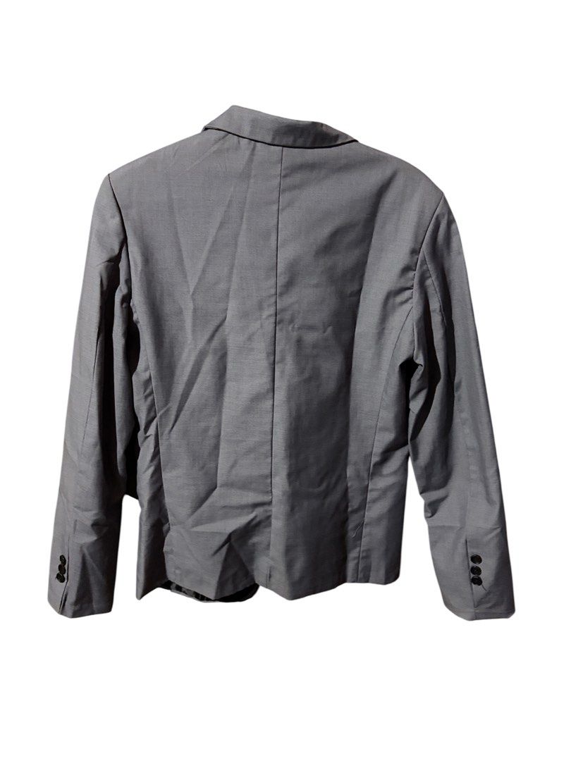 Grey Blazer with Black Lapels (Category: Coats, Jackets and Outerwear) located in Antipolo. Submitted by joyeduarte175 (Listing ID 1468767929, Image 2). Description: - Color: Grey with contrasting black lapels and pocket trims - Closure: Single button front - Pockets: Single welt chest pocket with white pocket square accent - Details: Structured shoulders, decorative cuff buttons - Lining: Fully lined in black interior - Condition: Excellent / Re