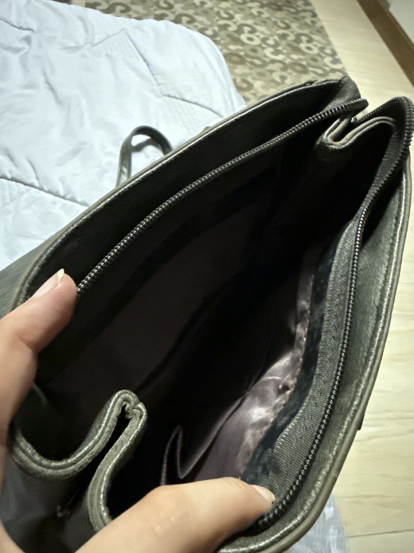 Leather Gray backpack (Category: Backpacks) located in Caloocan City. Submitted by tootsief (Listing ID 1468866490, Image 3). Description: - Material: Premium grey faux leather - Closure: Flap top with secure circular metal lock - Straps: Adjustable back straps and a convenient top handle - Interior: Clean, fully lined compartment with a zipper closure and extra pockets - Capacity: Roomy enough to hold all your daily essentials.