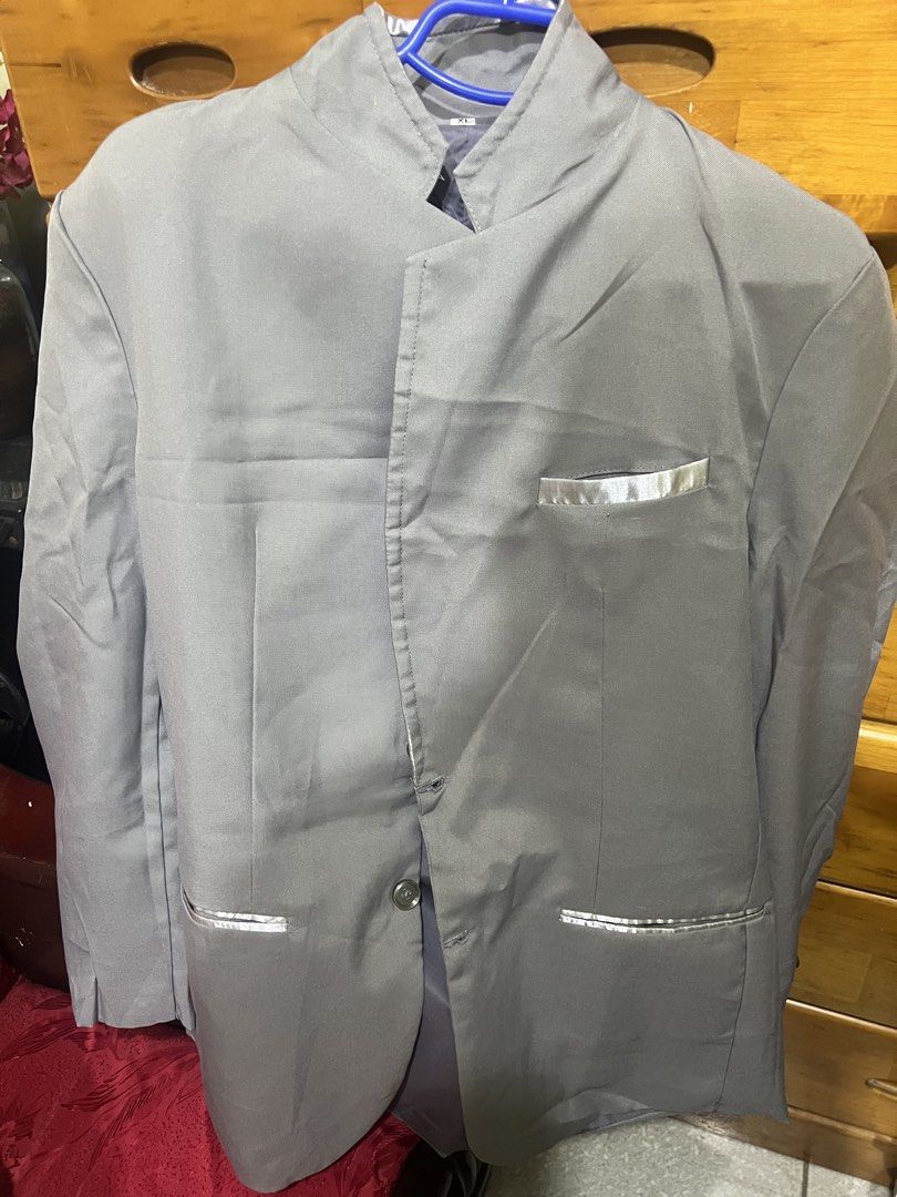 Grey Mandarin Collar Blazer Suit Jacket Size XL (Category: Coats, Jackets and Outerwear) located in Carmona. Submitted by tonette95 (Listing ID 1468778258, Image 1). Description: - Style: Grey single-breasted blazer with a modern mandarin collar - Size: XL - Details: Eye-catching shiny silver trim on one chest pocket and two lower pockets - Material: Smooth, comfortable fabric - Occasion: Ideal for dressing up for formal events, parties, or dinne