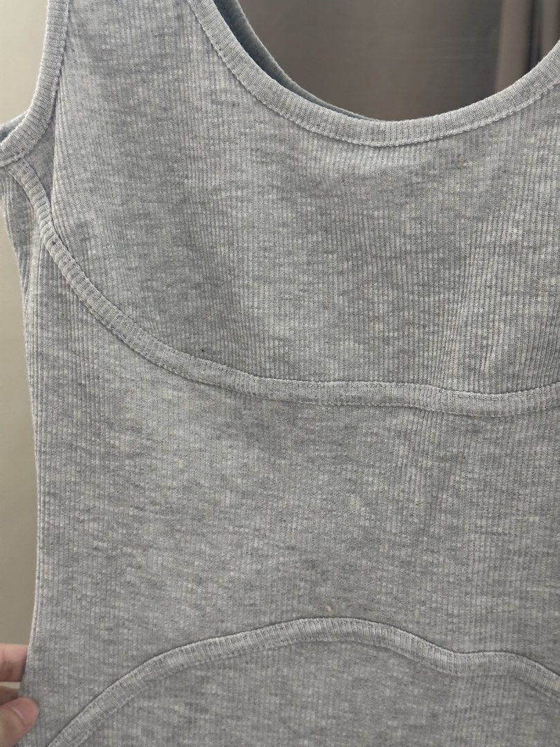 Grey Ribbed Bodysuit Romper Biker Shorts (Category: Rompers) located in Villasis. Submitted by juliaxgamboa (Listing ID 1468808931, Image 2). Description: - Style: Grey ribbed romper with biker shorts - Neckline & Straps: Scoop neck with thick straps - Design: Paneled stitching around chest and lower stomach for a flattering shape - Material: Stretchy cotton knit - Condition: Clean, no stains or holes - Versatility: Perfect for casual days out or