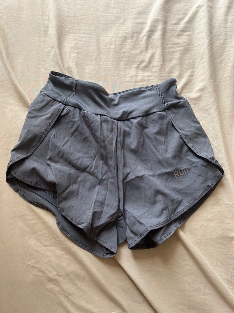 Grey Running Shorts (Category: Activewear) located in Quezon City. Submitted by cath.declutters (Listing ID 1468745088, Image 1). Description: - RFS: Doesn’t fit. Small size. - Style: Athletic running shorts with curved hem - Fit: Comfortable wide waistband - Features: Built-in inner lining for extra coverage and lightweight, breathable fabric - Condition: Brand new - Mode of Payment: GCash, or Bank Transfer - Shipping: Grab or Lalamove.