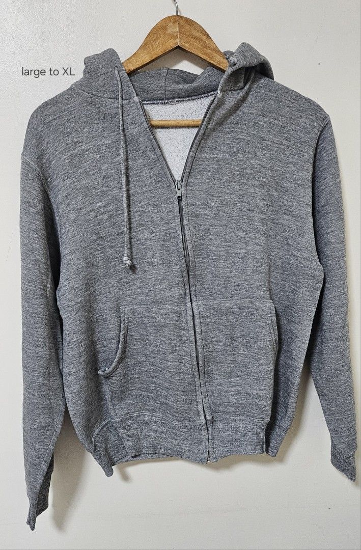 Grey Zip-Up Hoodie (Category: Coats, Jackets and Outerwear) located in Laoag. Submitted by __baptistakim (Listing ID 1468821371, Image 1). Description: Grey zip-up hoodie, heather knit fabric. Front kangaroo pocket, matching drawstring hood. Ribbed cuffs and hem. Full front zipper closure. Fits large to xl. Casual everyday layering piece, comfortable cotton blend material inside..