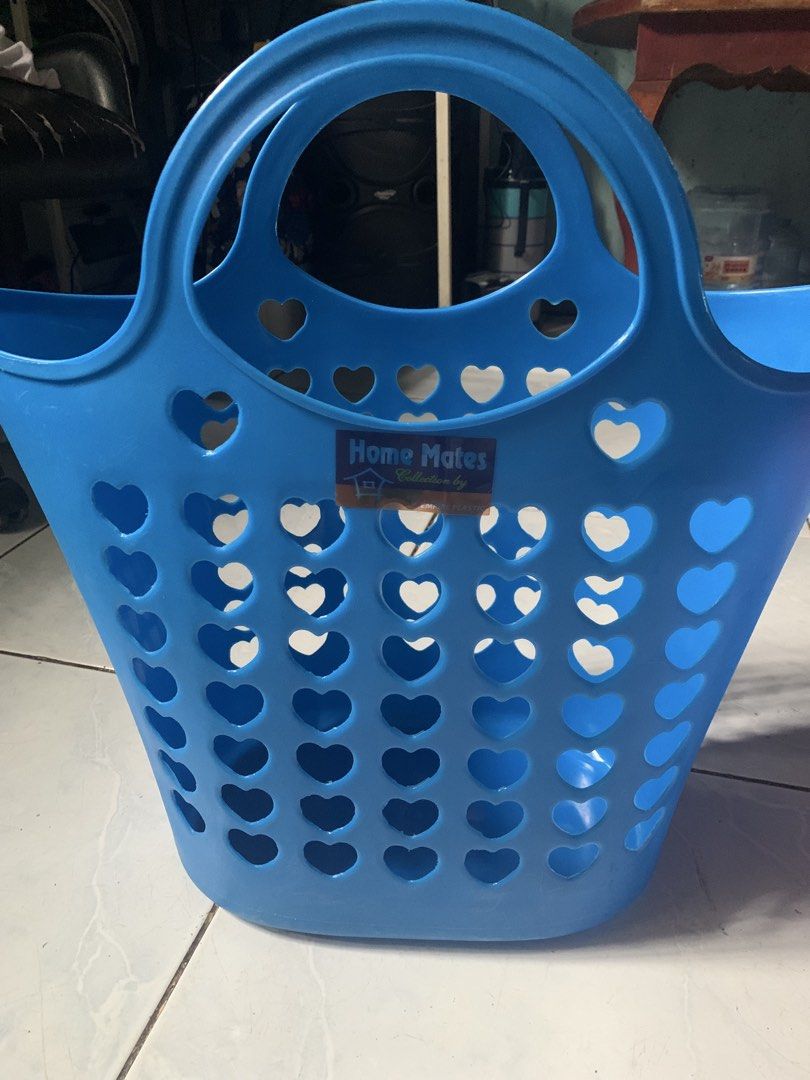 grocery basket set with flower props (Category: Laundry Baskets) located in Valenzuela. Submitted by diane.35 (Listing ID 1468747929, Image 1). Description: - Brand: Home Mates - Color: Blue - Material: Lightweight and durable plastic - Design: Cute cutout heart patterns for ventilation - Features: Sturdy built-in double handles - Condition: Clean, original label sticker still intact - Ideal Use: Laundry, clothes organization, toys, and general h