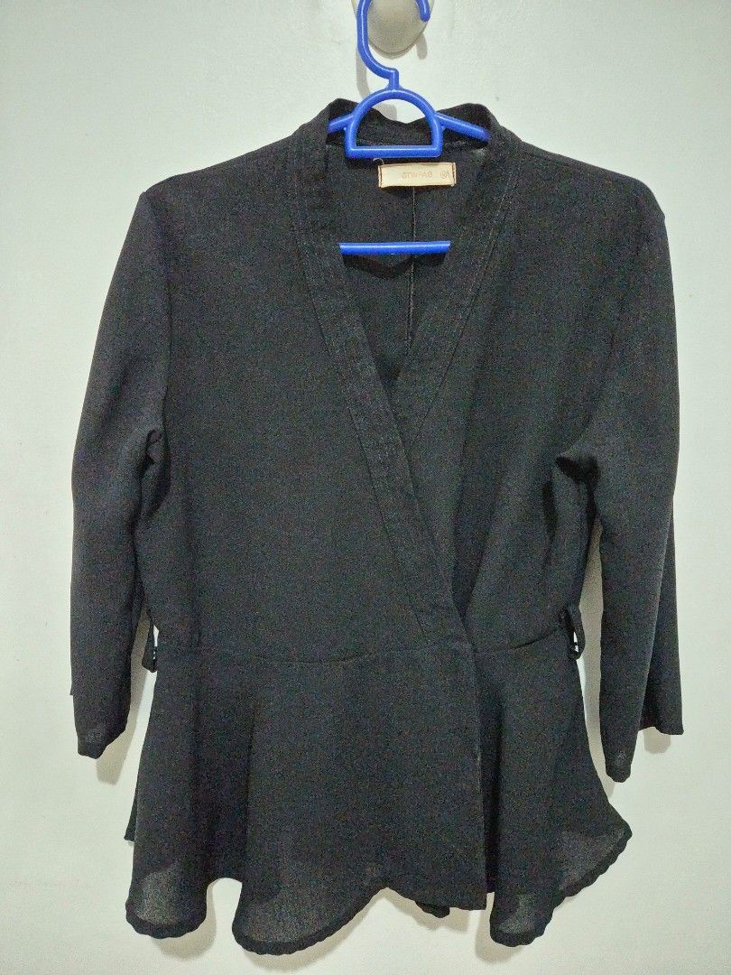 GTW FAB Black Long Sleeve Peplum Blazer Jacket (Category: Coats, Jackets and Outerwear) located in Mandaluyong City. Submitted by joyce1593 (Listing ID 1468819123, Image 1). Description: - Brand: GTW FAB - Color: Black - Style: V-neck wrap front peplum blazer with long sleeves and flared ruffle hem - Fit: Structured shoulders and fitted waist silhouette - Details: Clean back with vertical seam detail - Fabric: Lightweight and easy to style for wo