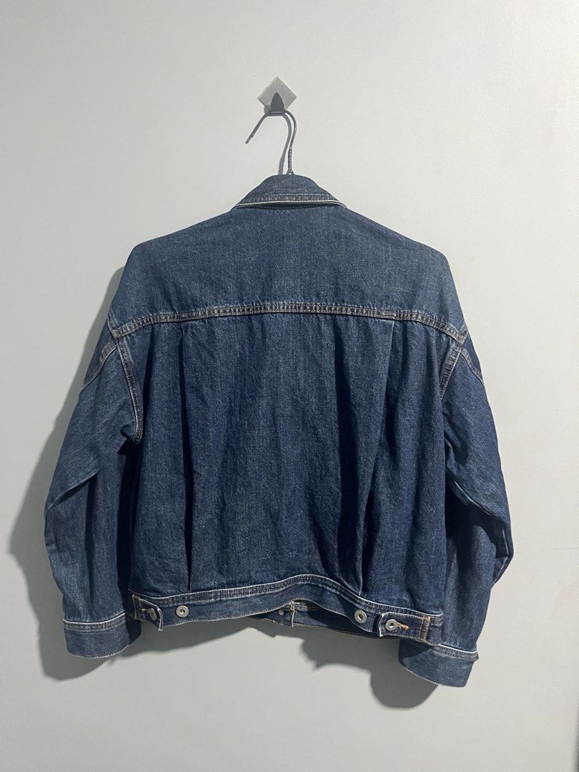 GU Blue Denim Jacket Size S (Category: Coats, Jackets and Outerwear) located in Aloran. Submitted by hiddenrack_0406 (Listing ID 1468845241, Image 3). Description: - Brand: GU - Size: Small - L 22 in W 20 in - Style: Classic denim jacket with button-up front, chest flap pockets, and side slip pockets - Color: Dark blue wash - Size: S - Material: 100% cotton - Condition: Clean, well-maintained, great layering piece for casual wear.