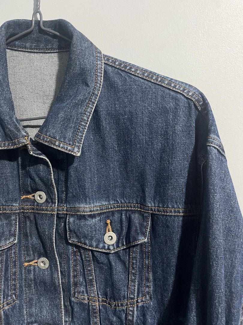 GU Blue Denim Jacket Size S (Category: Coats, Jackets and Outerwear) located in Aloran. Submitted by hiddenrack_0406 (Listing ID 1468845241, Image 2). Description: - Brand: GU - Size: Small - L 22 in W 20 in - Style: Classic denim jacket with button-up front, chest flap pockets, and side slip pockets - Color: Dark blue wash - Size: S - Material: 100% cotton - Condition: Clean, well-maintained, great layering piece for casual wear.