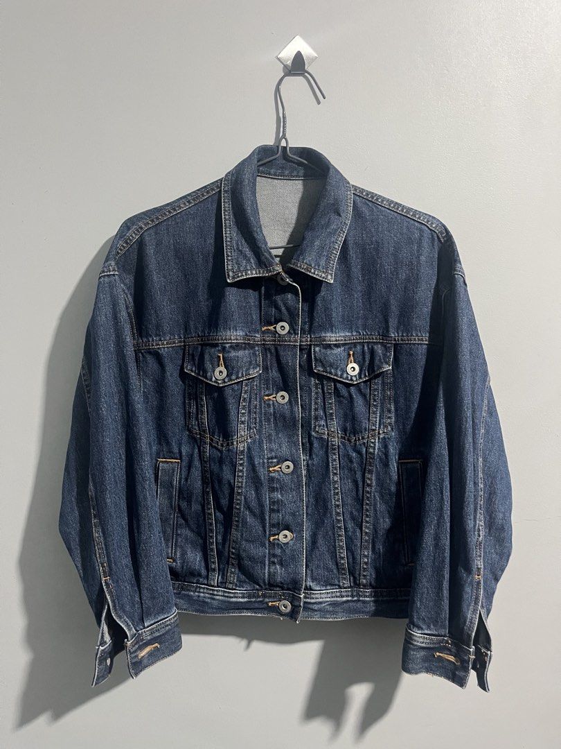 GU Blue Denim Jacket Size S (Category: Coats, Jackets and Outerwear) located in Aloran. Submitted by hiddenrack_0406 (Listing ID 1468845241, Image 1). Description: - Brand: GU - Size: Small - L 22 in W 20 in - Style: Classic denim jacket with button-up front, chest flap pockets, and side slip pockets - Color: Dark blue wash - Size: S - Material: 100% cotton - Condition: Clean, well-maintained, great layering piece for casual wear.